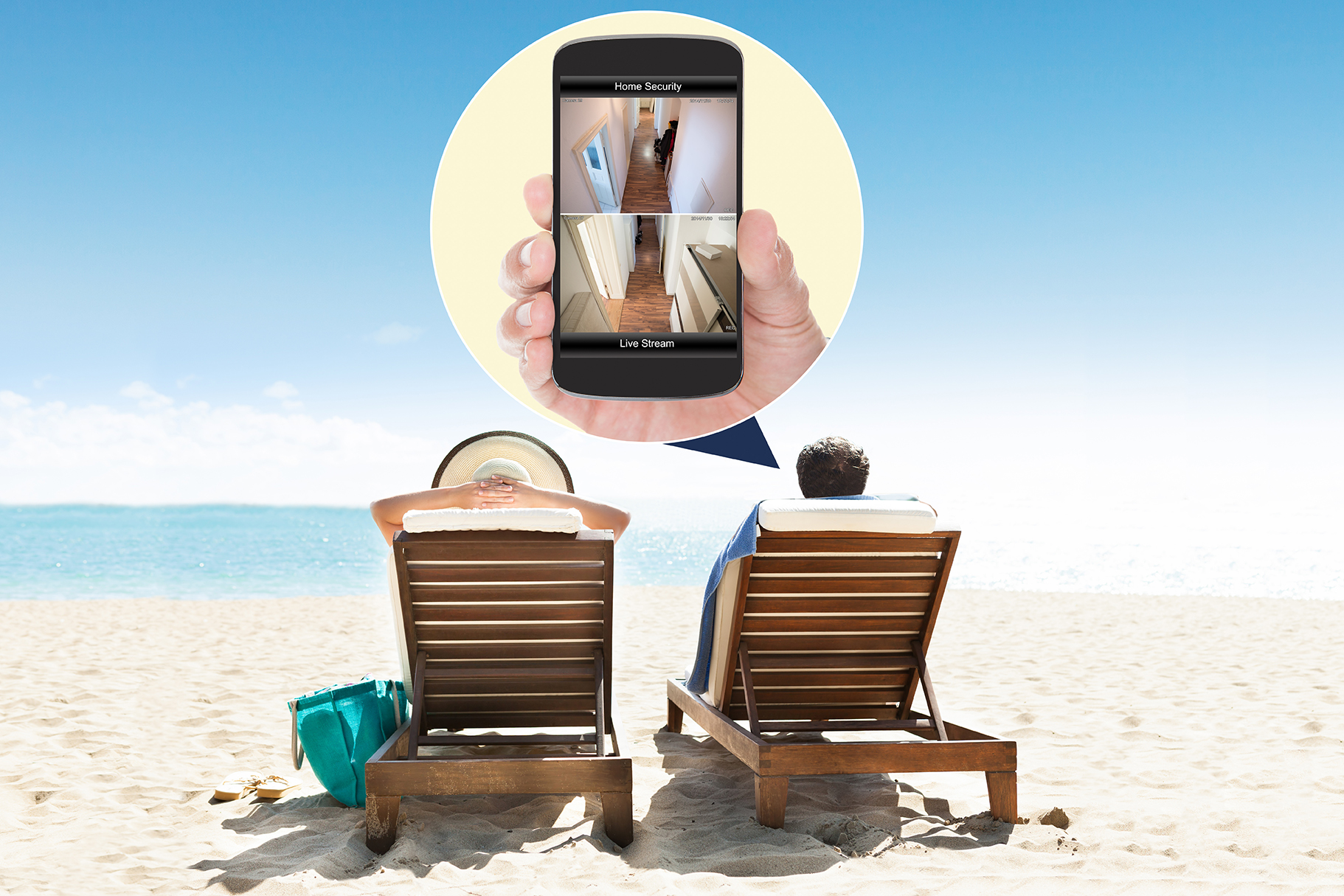 Rear view of couple relaxing on deck chairs at beach resort